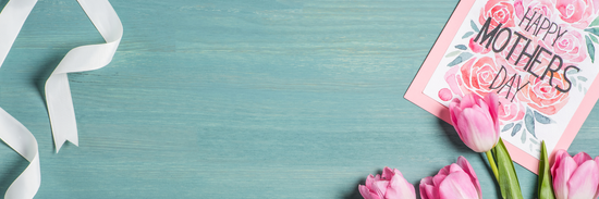 blue background with white ribbon on the left hand side and a mothers day card in pink with pink tulips over top on the right hand side for mothers day card ideas